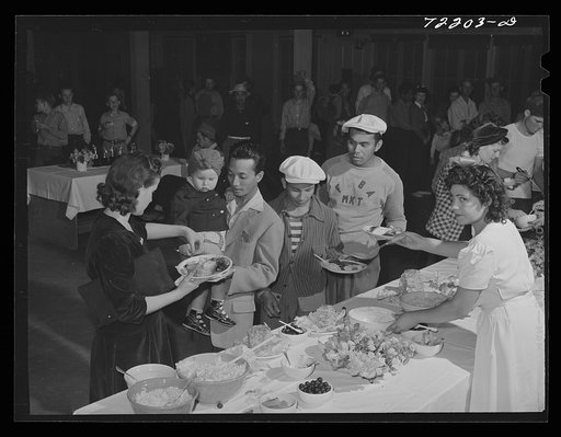 Dinner in the community auditorium at the second annual field day  at the FSA (Farm Security Administration) farm workers' community. Yuma, Arizona