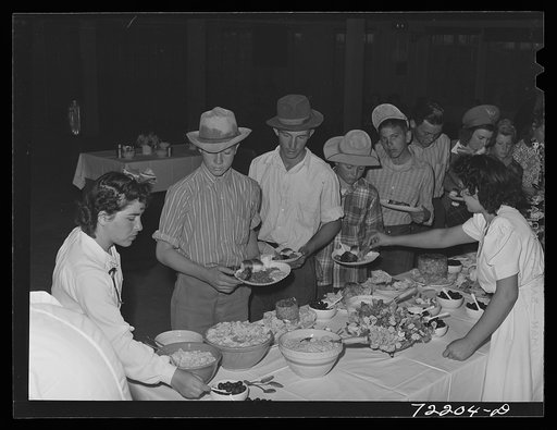 Dinner in the community auditorium at the second annual field day  at the FSA (Farm Security Administration) farm workers' community. Yuma, Arizona