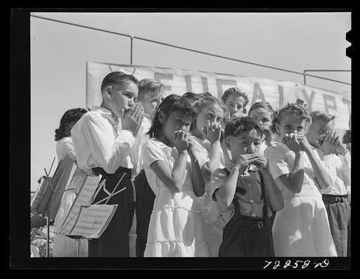 Untitled photo, possibly related to: Harmonica band, part of the schoolchildren's victory chorus at the Imperial County Fair, California