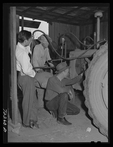 Los Angeles, California. The evacuation of Japanese-Americans from West coast areas under United States Army war emergency orders. White farmers inspecting farm machinery belonging to Japanese