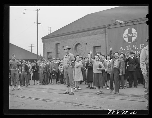 Los Angeles, California. The evacuation of Japanese-Americans from West coast areas under United States Army war emergency order. Japanese wave good-bye to friends and relatives who are leaving for Owens Valley. All Japanese will be evacuated eventually