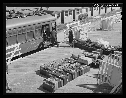Los Angeles County, California. The evacuation of Japanese-Americans from West coast areas under United States Army was emergency order. Baggage of Japanese arriving at the Santa Anita reception center