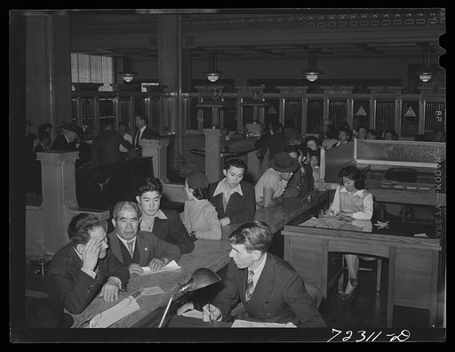 Los Angeles, California. The evacuation of Japanese-Americans from West coast areas under United States Army war emergency order. Japanese receive travel permits for voluntary evacuation