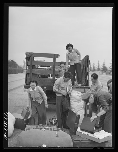 Los Angeles County, California. The evacuation of Japanese and Japanese-Americans from West coast areas under United States Army war emergency order. Baggage of the Japanese being examined upon arrival the Santa Anita reception center