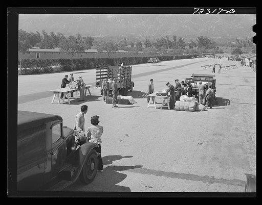 Los Angeles County, California. The evacuation of Japanese and Japanese-Americans from the West coast areas under Army war emergency order. Japanese baggage being examined on their arrival at the Santa Anita reception center