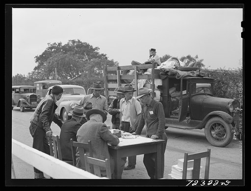 Los Angeles County, California. The evacuation of Japanese and Japanese-Americans from West coast areas under United States Army war emergency order. Japanese signing in at the Santa Anita reception center