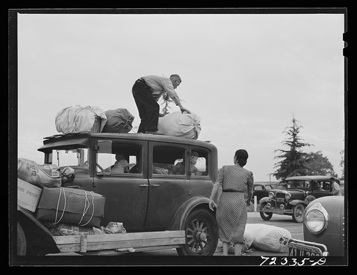 Santa Anita reception center, Los Angeles County, California. The evacuation of Japanese and Japanese-Americans from West coast areas under United States Army war emergency order. Japanese family arriving at the center