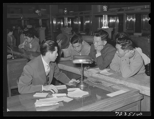 Los Angeles, California. The evacuation of Japanese and Japanese-Americans from West coast areas under United States Army war emergency order. Japanese registering for travel permits for voluntary evacuation