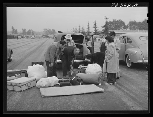 Santa Anita reception center, Los Angeles County, California. The evacuation of Japanese and Japanese-Americans from West coast areas under United States Army war emergency order. Japanese baggage is inspected on arrival
