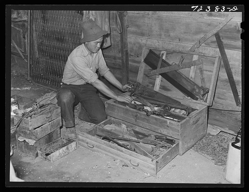 Los Angeles County, California. Japanese farmer packing up his tools before he is evacuated from West coast areas under United States Army war emergency order