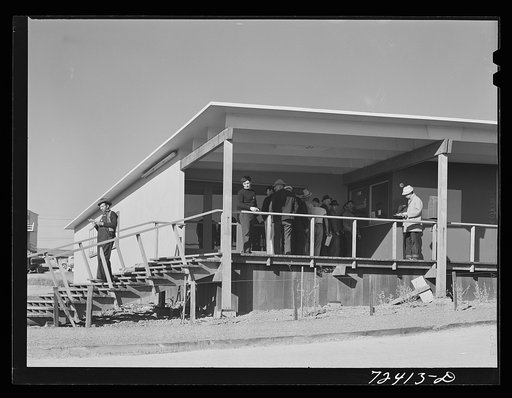 Vallejo, California. FSA (Farm Security Administration) defense housing project. Men calling for mail at the administration building