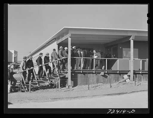 Vallejo, California. FSA (Farm Security Administration) defense housing project. Men calling for mail at the administration building