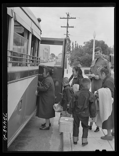 Salinas, California. Japanese-Americans boarding bus for reception center
