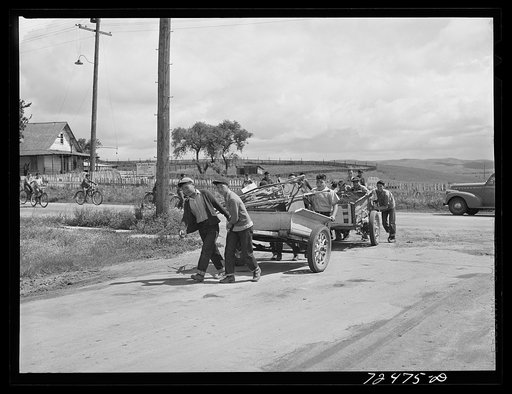 San Juan Bautista, California. Schoolchildren collecting scrap metal for the war. Japanese-American children who had not yet been evacuated from the area participated in the scrap collection drive