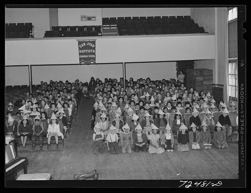 San Juan Bautista, California. Schoolchildren assembled to march in parade with the scrap metal they have collected for war