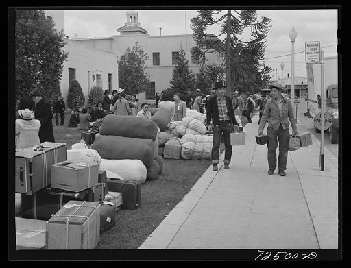Salinas, California. Japanese-Americans wait for transportation to reception center
