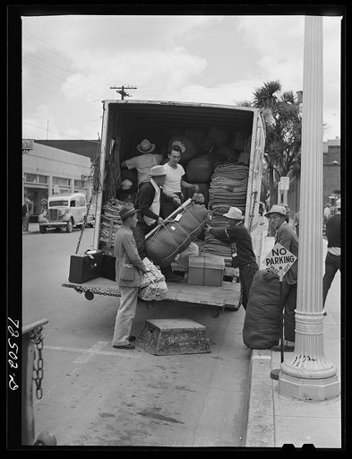 Salinas, California. It's no-parking, move-on-to-reception-center day for Japanese Americans