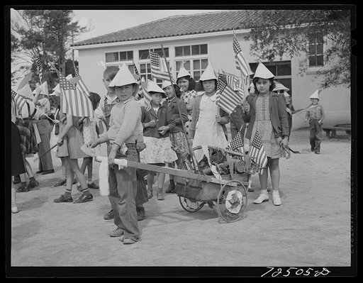 Schoolchildren who have collected scrap metal for war. San Juan Bautista, California