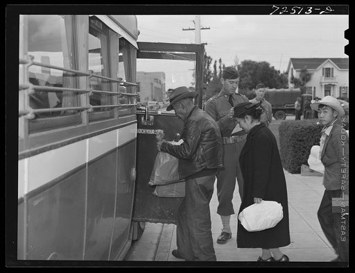 Salinas, California. Japanese-Americans boarding bus for transportation to reception center