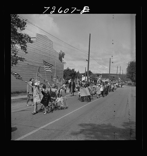 San Juan Bautista, California. Schoolchildren marching with scrap metal they have collected for the war
