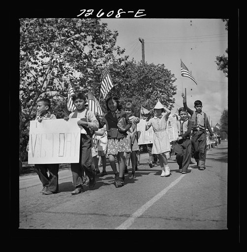 San Juan Bautista, California. Schoolchildren marching with scrap metal for the war