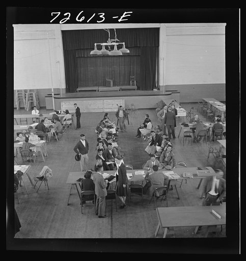 Salinas, California. Japanese-Americans getting information concerning evacuation orders
