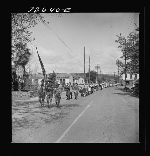 San Juan Bautista, California. Schoolchildren parade with scrap metal they have collected for the war
