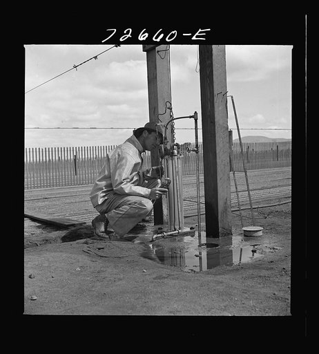 Untitled photo, possibly related to: Salinas, California. Irrigator at guayule nursery
