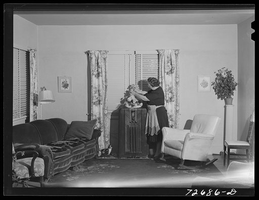Untitled photo, possibly related to: Turlock, California. Housewife in front room of her home