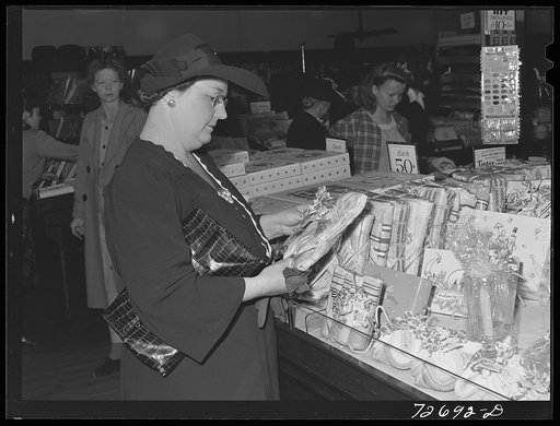 Turlock, California. Housewife shops for household goods, comparing prices and quality in various stores