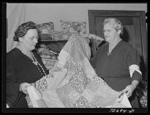 Turlock, California. Housewife (left) with some of the quilts the PTA (Parent Teacher Association) has made for the Red Cross. She is president of PTA