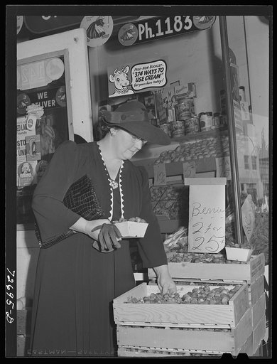 Turlock, California. Housewife shops for groceries. The fact that she no longer uses her automobile on shopping tours doesn't prevent her from comparing values in various stores