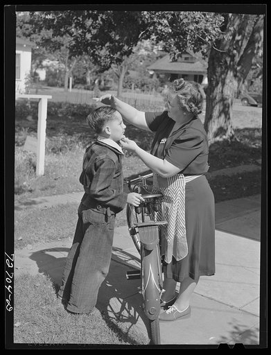 Turlock, California. Housewife sending her son off to school