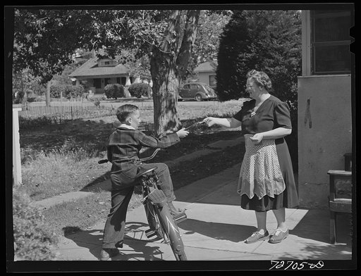 Turlock, California. Housewife sending her son off to school