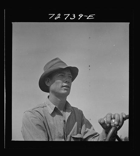 Untitled photo, possibly related to: Merced County, California. Tractor operator