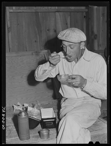 Untitled photo, possibly related to: Turlock, California. Workman at the dehydrating plant