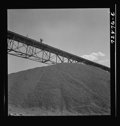 Shasta Dam, Shasta County, California. Pile of gravel under conveyor belt. The gravel will be used in construction of the dam