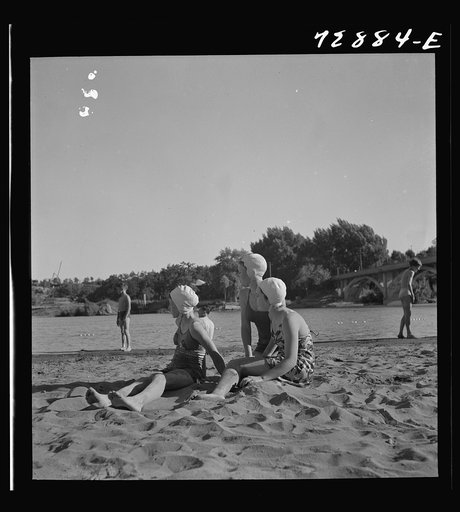 Redding, California. Young people on the beach of the Sacramento River