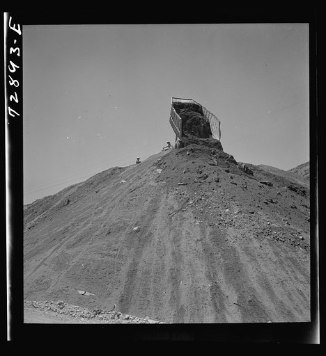 Untitled photo, possibly related to: Shasta Dam, Shasta County, California. Dumping load of dirt which has been excavated at site of the dam