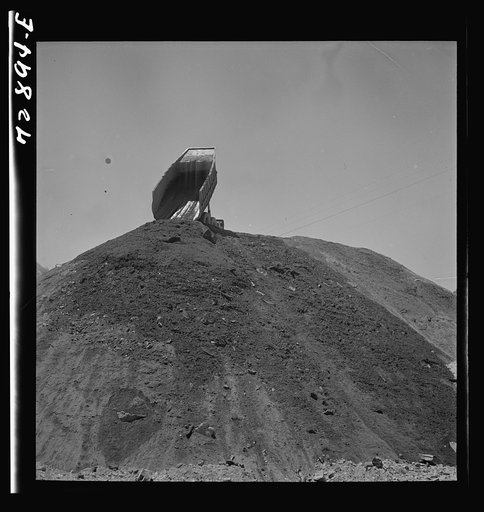 Untitled photo, possibly related to: Shasta Dam, Shasta County, California. Dumping load of dirt which has been excavated at site of the dam