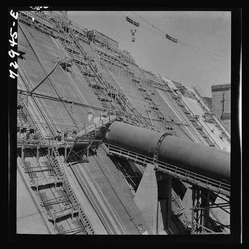 Shasta Dam, Shasta County, California. Dam under construction showing penstock, a pipe which carries water to the generators
