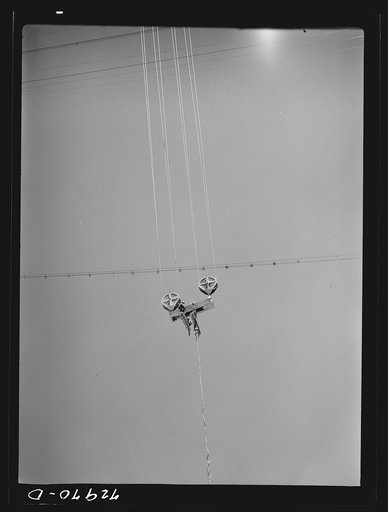 Shasta Dam, Shasta County, California. Cable carriage. Materials used in construction of the dam are carried to the exact construction site by cable cars or buckets which are strung from a central tower to several towers