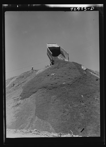 Shasta Dam, Shasta County, California. Dumping load of dirt which has been excavated at site of the dam