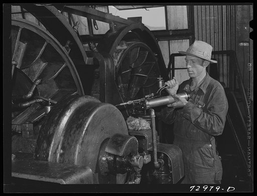Shasta Dam, Shasta County, California. Lubricating a bearing in cable control room in the head tower