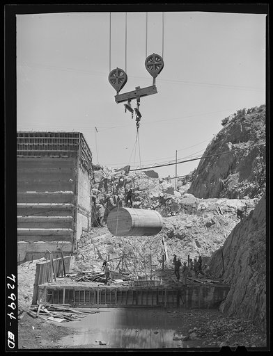 Shasta Dam, Shasta County, California. Lowering a sump into bottom of the dam