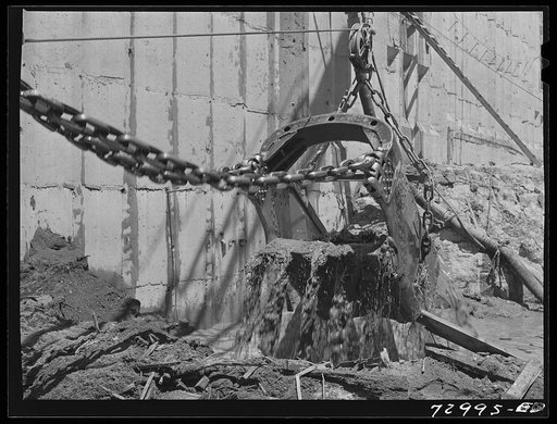 Shasta Dam, Shasta County, California. Excavating mud in construction of the dam