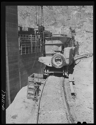 Shasta Dam, Shasta County, California. Car which runs on a circular track and brings concrete from mixing depot to point where cable buckets are loaded from the car