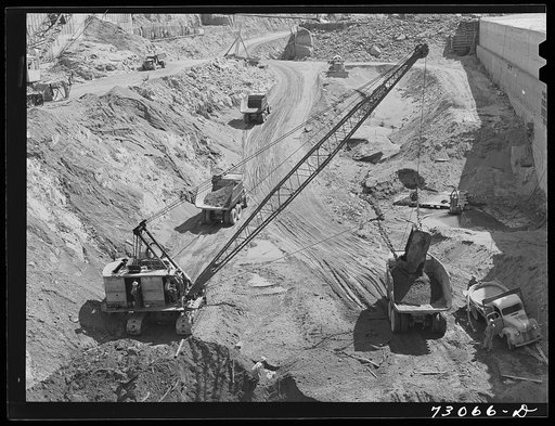Shasta Dam, Shasta County, California. Steam shovels and dump trucks excavate at the dam