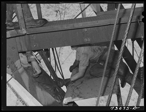 Untitled photo, possibly related to: Shasta Dam, Shasta County, California. Grease monkeys working in the channel irons of the head tower