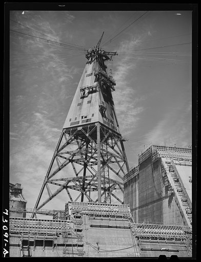 Shasta Dam, Shasta County, California. Head tower at the dam. The cables which operate from this tower to several tail towers carry cable cars and buckets which supply materials to the construction areas of the dam